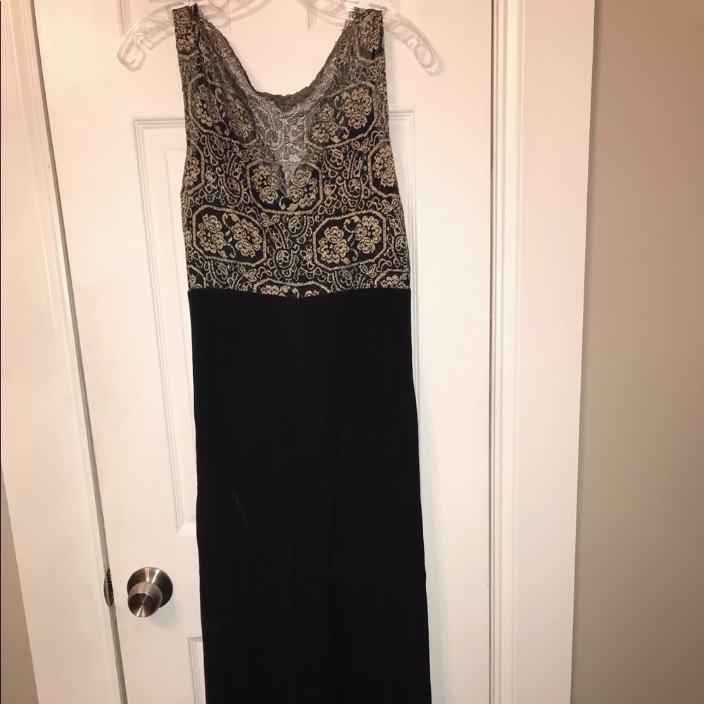 Sleeveless maxi with gold lace top and black chiffon bottom.